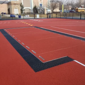 Aluminum Sand Pit Cover preventing debris from getting in and sand from getting out onto the track