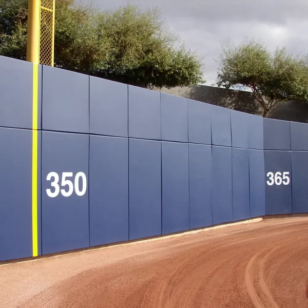 blue BaseZone® Field Wall Padding installed up the foul line