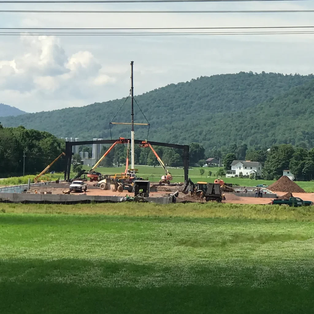 From a distance, crews are setting up the initial infrastructure of the new Sportsfield Specialties manufacturing facility in Delhi, NY