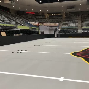 black dasher board padding installed at indoor football arena