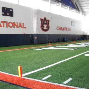 weighted end zone pylons installed in an indoor football practice facility