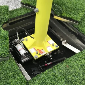 a football goal access frame kit installed in a synthetic turf field with a plate mount football goal post installed