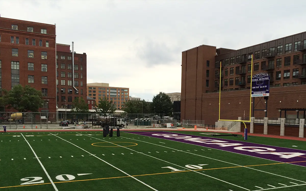 Looking onto the multi-use Buchanan field at Gonzaga college high school. Football goal post and safety netting by Sportsfield Specialties is installed.