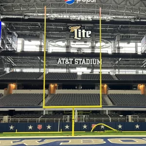Ground Sleeve Gooseneck Hinged AdjustRight® Football Goal Posts in the upright position at AT&T stadium