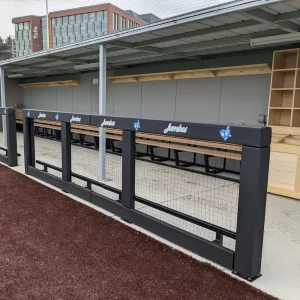 Guard Rail System installed with an enclosed dugout by Sportsfield Specialties