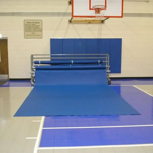 Gym floor cover by Sportsfield Specialties rolled out on gymnasium floor