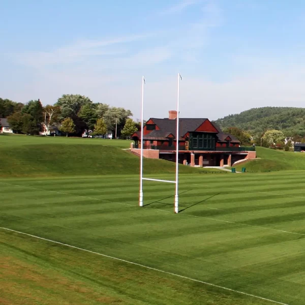 a hinged rugby goal post installed on a playing field