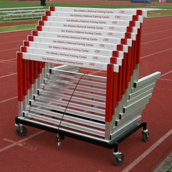 red sportsfield specialties hurdles sitting on a transport cart