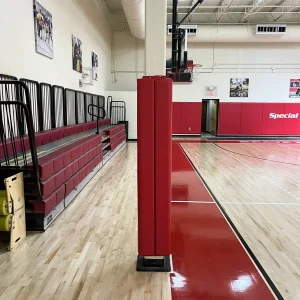 a column in a indoor gymnasium protecting its players with indoor column padding