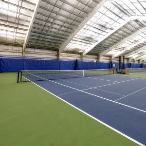 Internal Wind Tennis Systems installed at an indoor tennis court