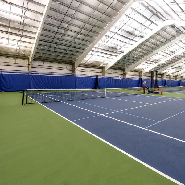 Internal Wind Tennis Systems installed at an indoor tennis court