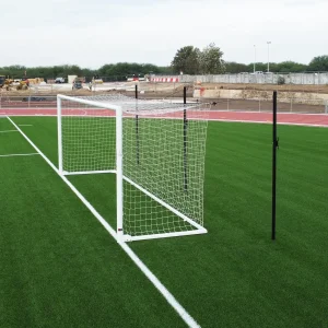 an international soccer goal installed on a synthetic turf soccer field ready for the game to start