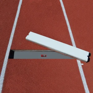a long triple jump take-off board installed in a track surface