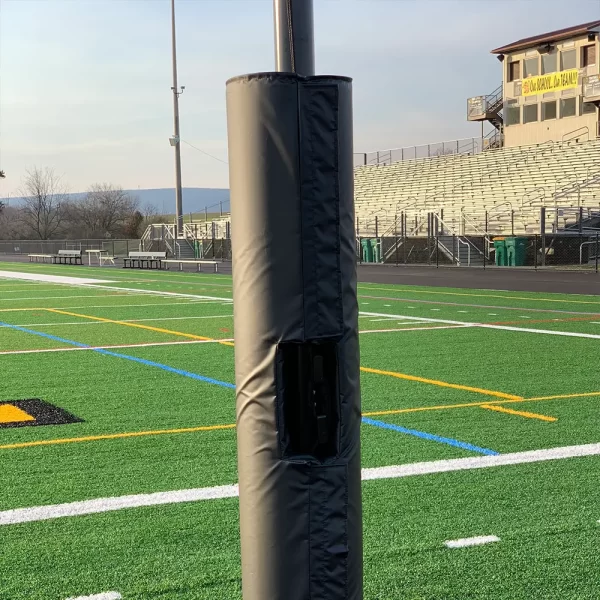 black netting post padding installed with a protective netting system to prevent balls from flying off the playing field