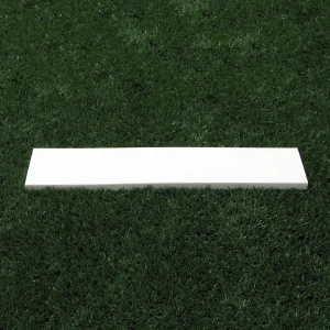 a TurfBase® pitching rubber sitting on a synthetic turf playing field