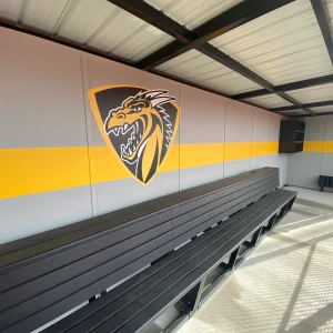the black polyboard team bench installed in an enclosed dugout