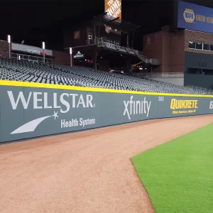 ProZone® Field Wall Padding up the side of the outfield wall of a baseball stadium