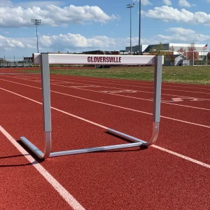 a rocker hurdle sits alone on a track running surface at Gloversville high school