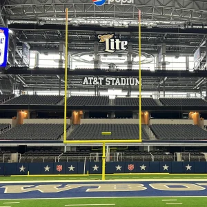 a rotating gooseneck hinged football goal post in the upright position at AT&T Stadium for the Dallas Cowboys