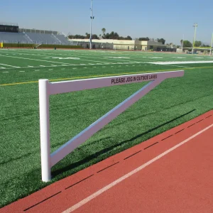 a rotating lane gate in the open position next to a track running surface