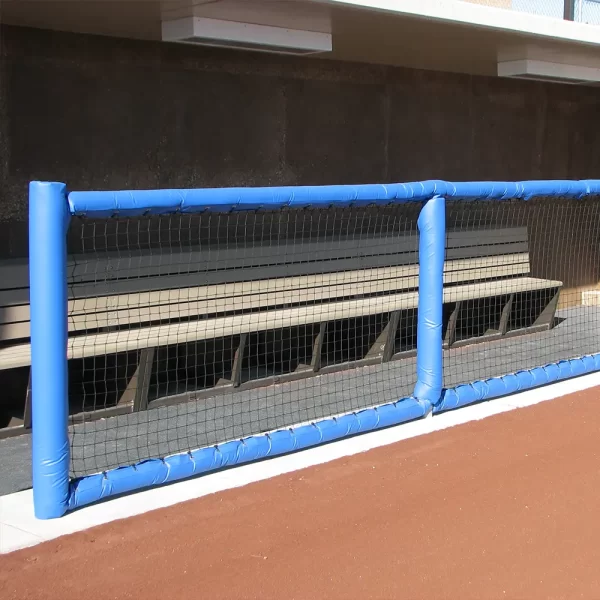 light blue Round Guard Rail Padding installed in front of modular dugout