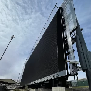 Custom scoreboard netting system installed over a stadiums digital scoreboard