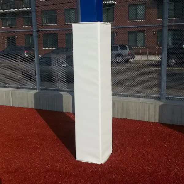 white scoreboard post padding installed at the base of a scoreboard