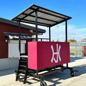 A ground level scorer's table by sportsfield specialties on the sidelines at the Auburn Maroons ball field