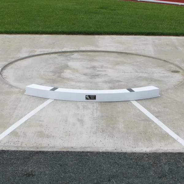 a Shot Put Toe Board installed on a shot put throwing surface ready for the big event