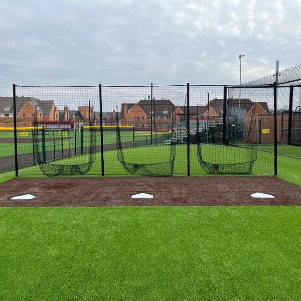 soft toss netting system with 3 stations installed on a synthetic turf practice field for baseball and softball