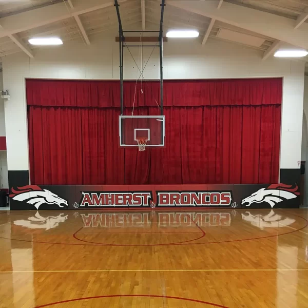 state mats installed at the Amherst Broncos indoor basketball court with digitally printed graphics