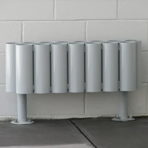 a grey stand alone bat storage rack mounted to a dugout floor