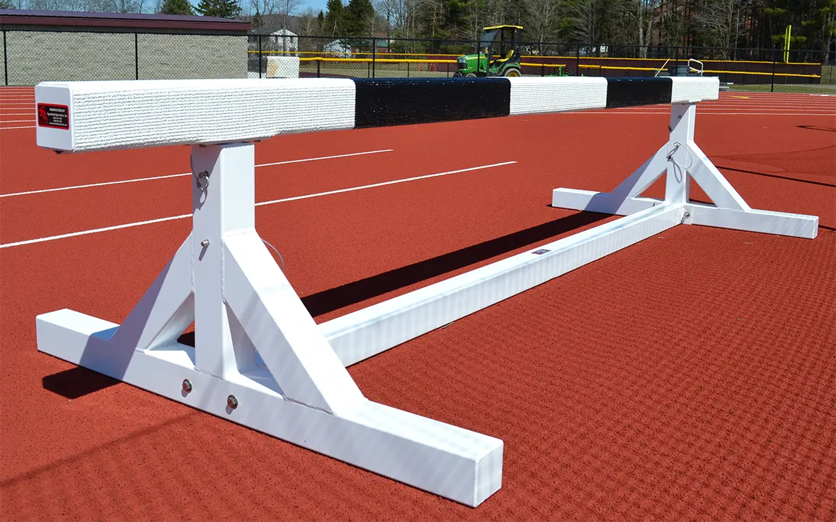 stationary steeplechase hurdle by sportsfield specialties sitting on the running track