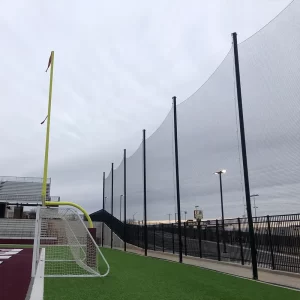 StormGuard® Multi-Sport Netting Systems installed at a multi-use facility to separate the football field from the parking lot