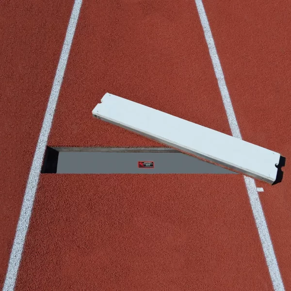 Textured polyboard take-off board laying on the track ready to be used during the long-triple jump event