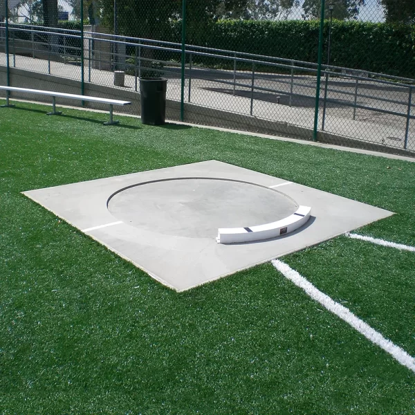 a Throw & Conversion Ring installed in a concrete throwing surface along with a fixed shot put toe board