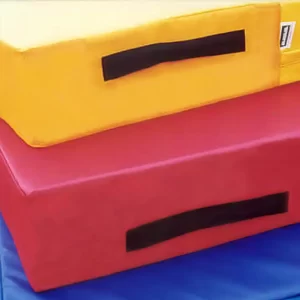 Yellow, red and blue training mats by Sportsfield Specialties stacked