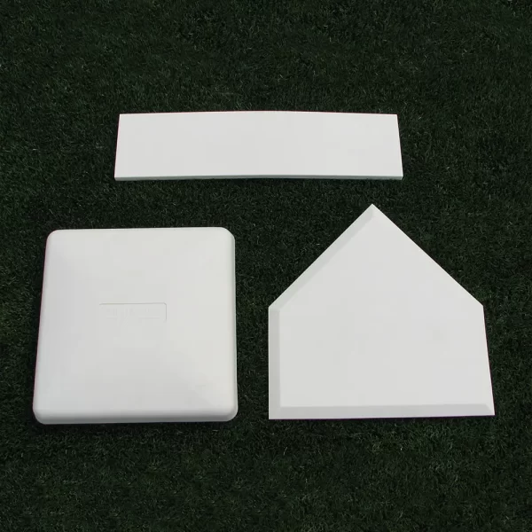 TurfBase® Bases, Home Plates & Pitching Rubbers laying down together on a synthetic turf field