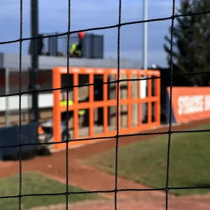 looking through Ultra Cross® knotless netting installed on a Syracuse softball playing field