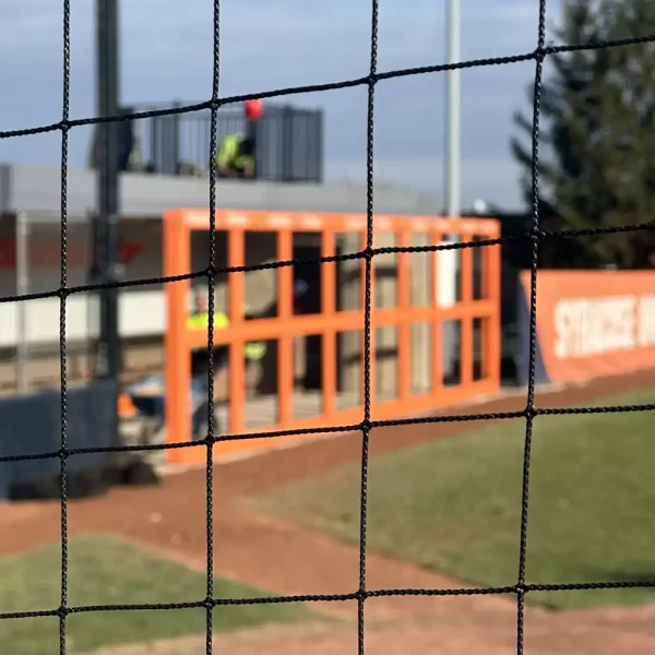 Ultra Cross® Knotless Netting installed in a guard rail system at the Syracuse Softball synthetic turf playing field