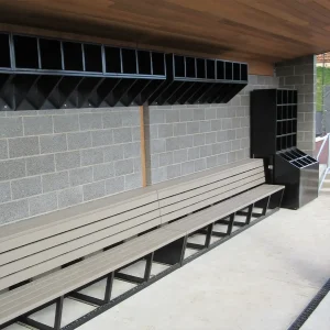 an enclosed dugout with wall mounted storage shelves and racks