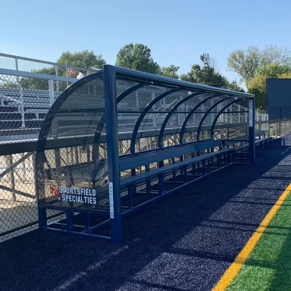 A blue WeatherScape® Team Shelter on the side of a multi-use ball field in its upright position